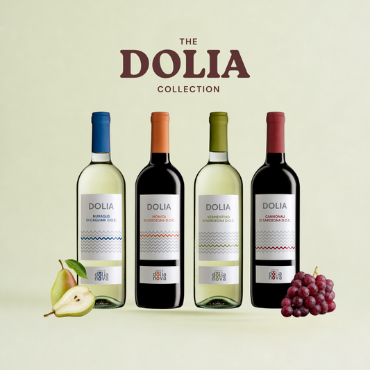 Dolia Collection Sardinian wine case with red and white wines, grapes and pear on a soft neutral background by Cantina di Dolianova