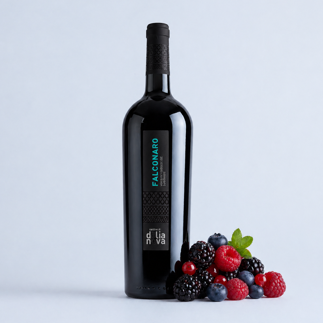 Falconaro Carignano Isola Dei Nuraghi IGT Sardinian red wine bottle with mixed berries on a soft grey background