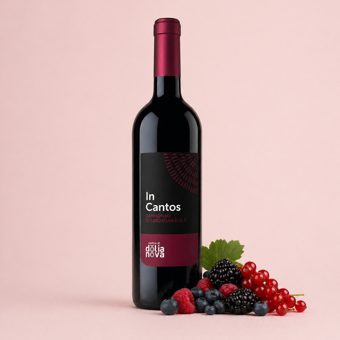 InCantos Cannonau di Sardegna red wine bottle with mixed berries on a light background