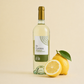 InCantos Vermentino di Sardegna white wine bottle with fresh lemon on a light background