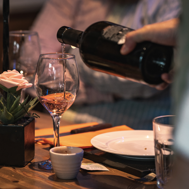 Rosada Cannonau di Sardegna DOC rosé by Cantina di Dolianova being poured into a wine glass