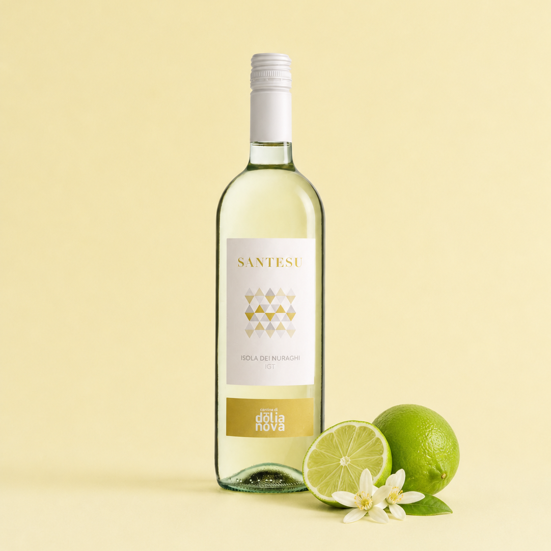Santesu Bianco Sardinian white wine with lime and white flowers on a soft yellow background