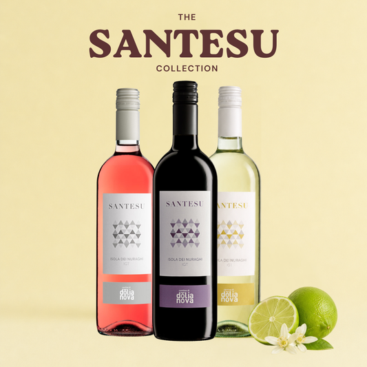 The Santesu Collection Sardinian wine bundle with red, white and rosé bottles with citrus on a soft yellow background