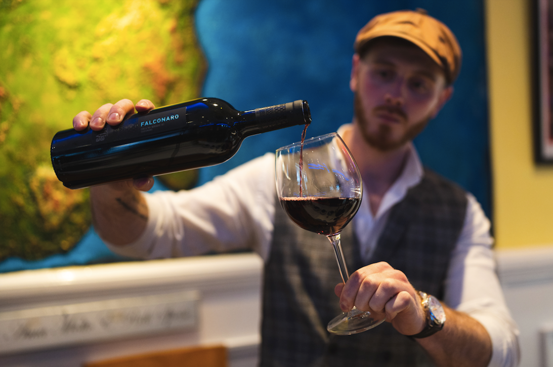 Falconaro Carignano Isola dei Nuraghi IGT Sardinian red wine being poured into a glass